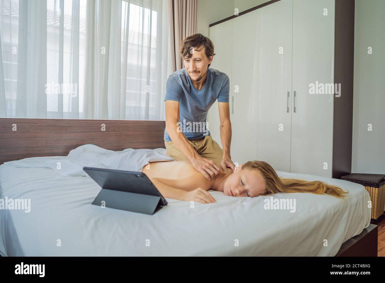 Massage by training online video. Online massage training. Health Wellness Massage Online Training Concept Stock Photo