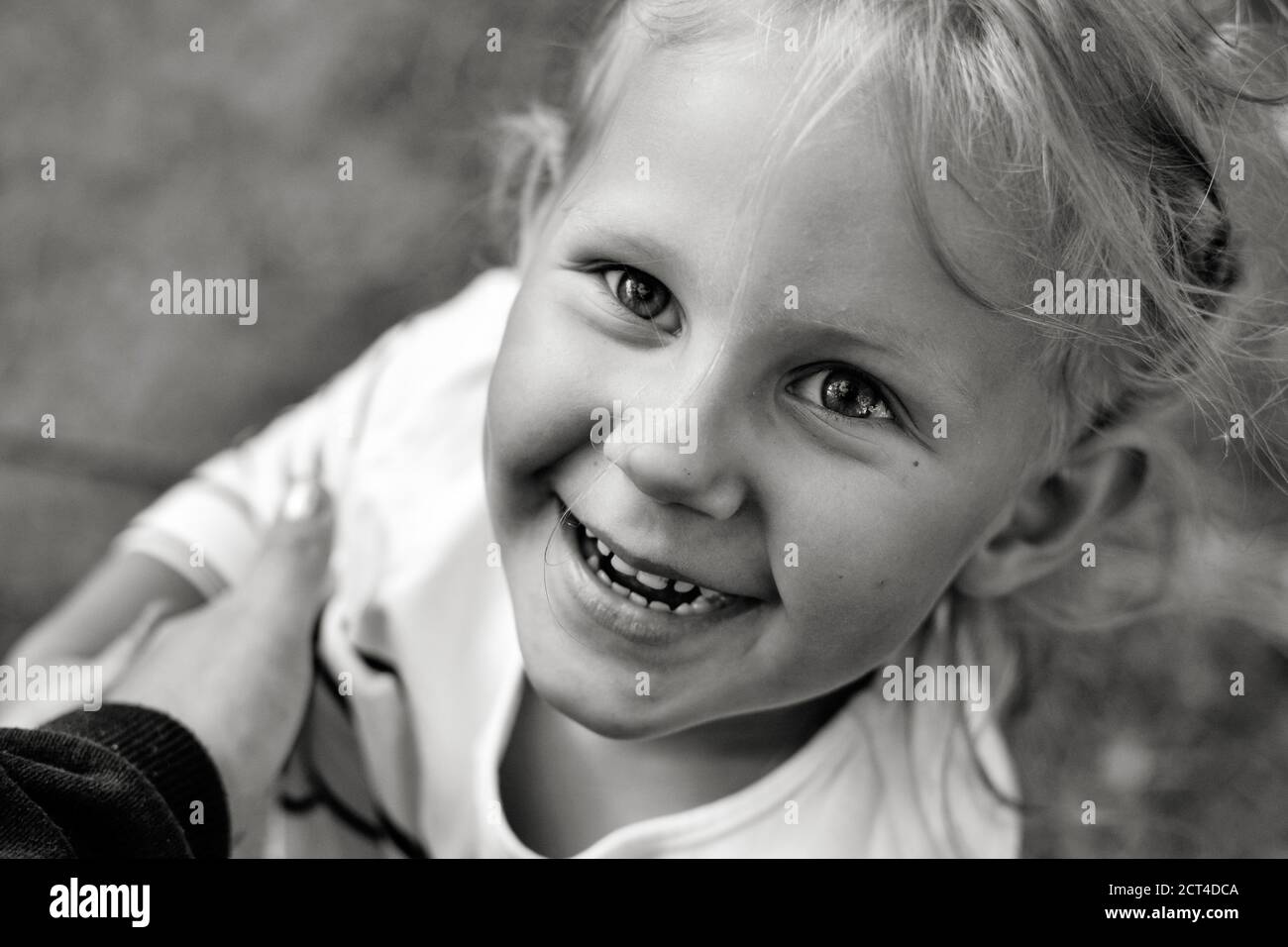 Close up black and white portrait of cute adorable smiling caucasian