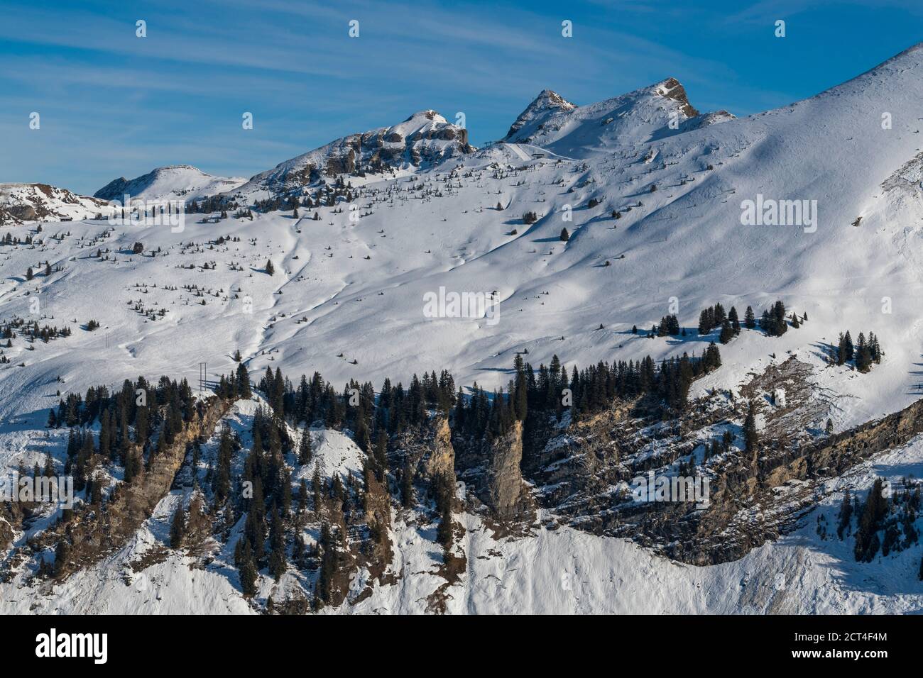 Beautiful snowcapped mountains with blue sky at the ski resort of Morzine in the Alps Mountain Range of France, Europe Stock Photo