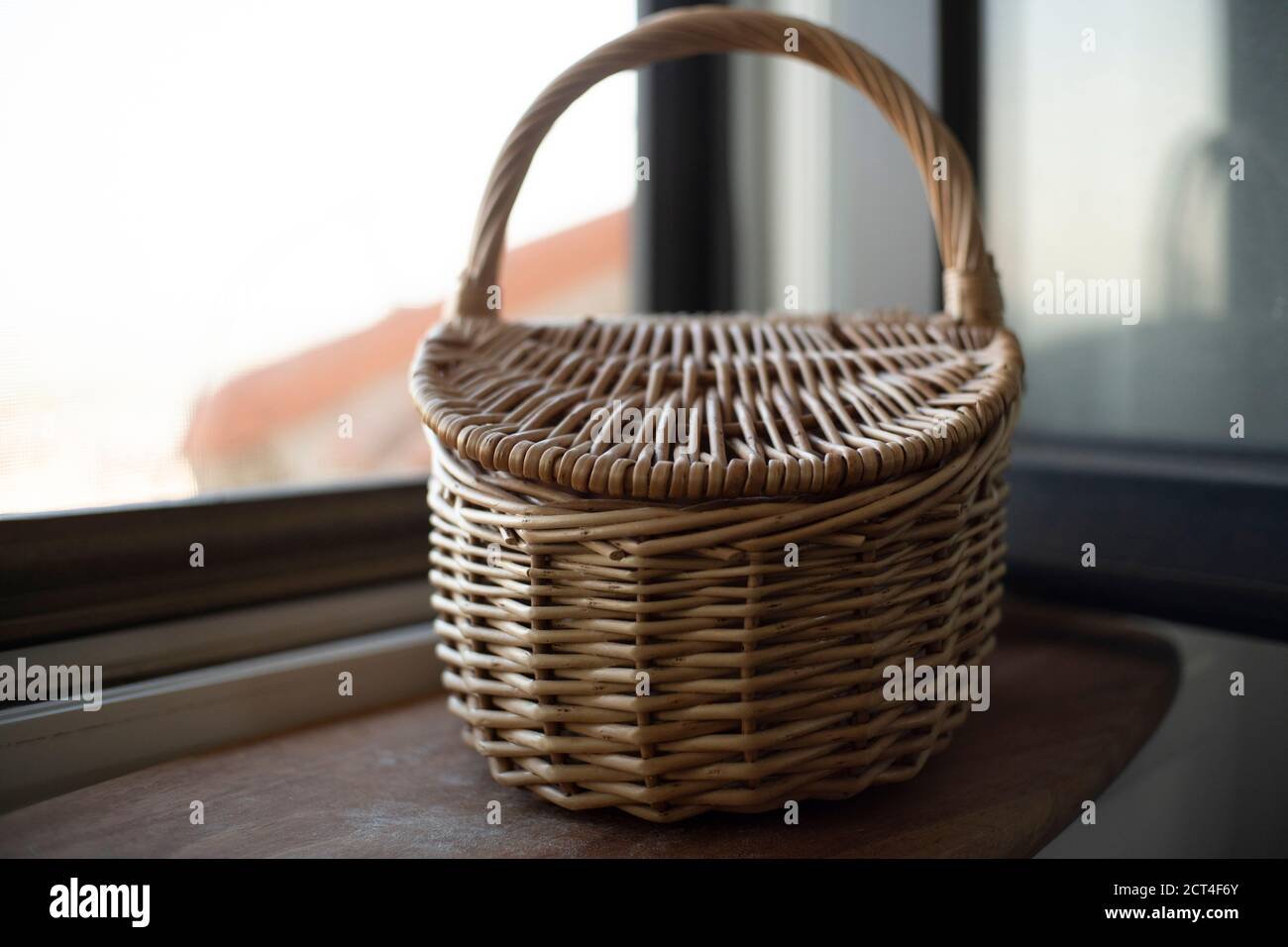 Rustic wicker on window sill Stock Photo Alamy