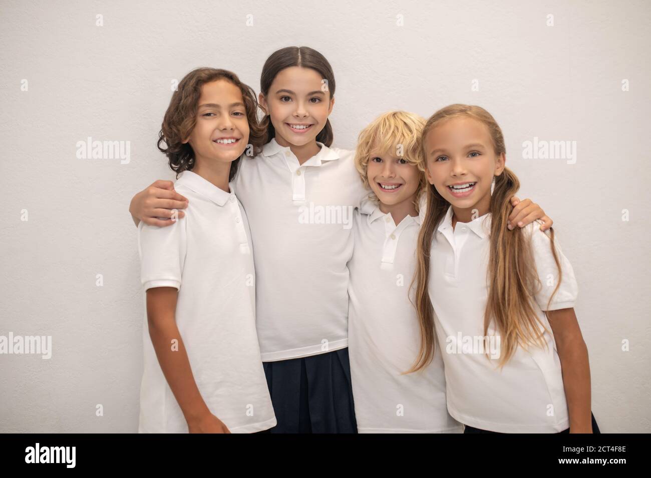 Schoolchildren hugging hi-res stock photography and images - Alamy