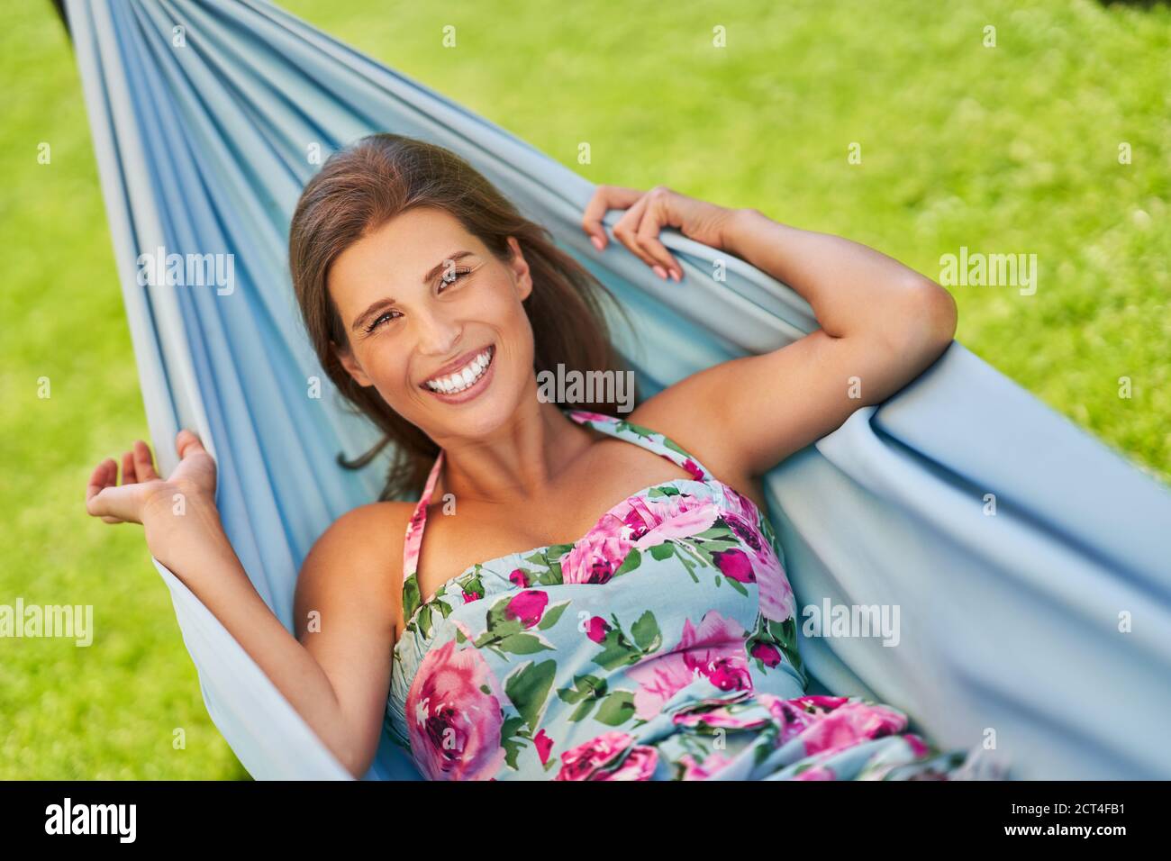 Pretty woman Relaxing In Hammock Stock Photo - Alamy