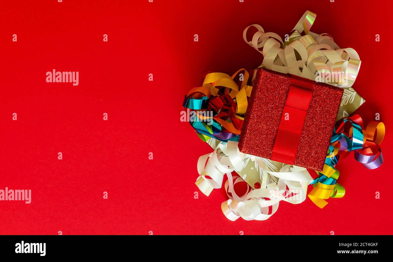 Christmas background with gift boxes and decorations on red.  Stock Photo