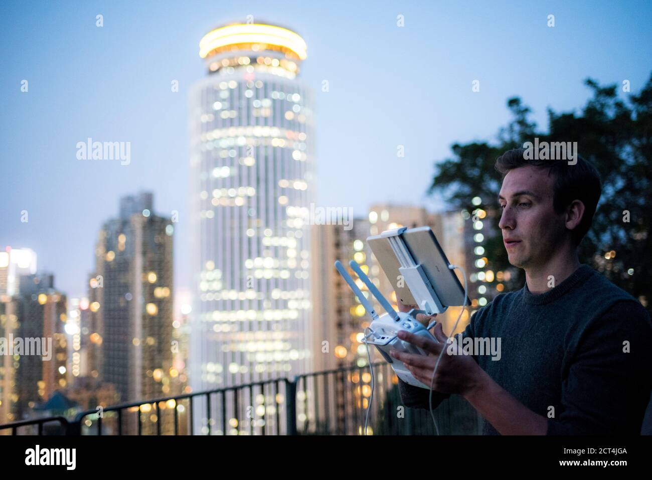 Flying a drone at night, Hong Kong Island, Hong Kong, China Stock Photo