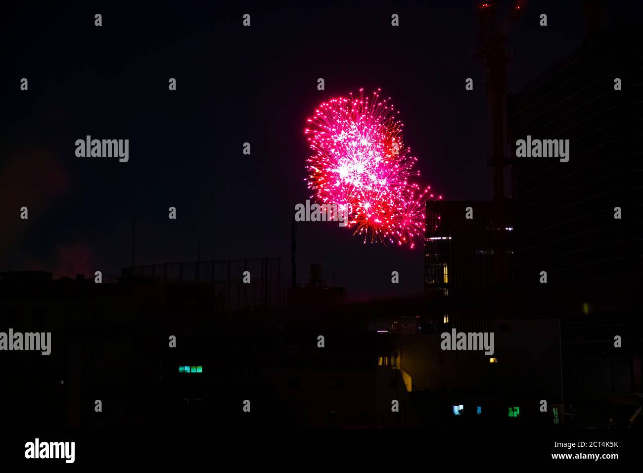Fireworks near the building at the urban city in Tokyo at summer night Stock Photo