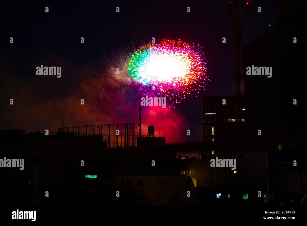 Fireworks near the building at the urban city in Tokyo at summer night Stock Photo