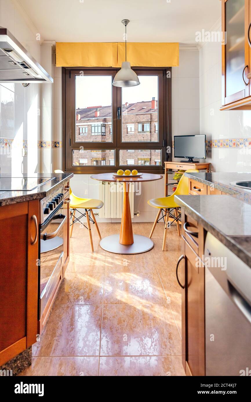 Kitchen on two fronts with dining area Stock Photo