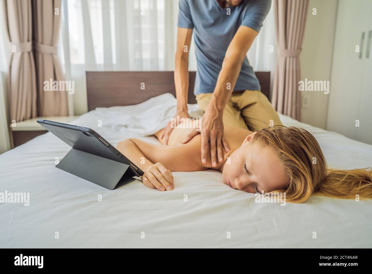 Massage by training online video. Online massage training. Health Wellness Massage Online Training Concept Stock Photo