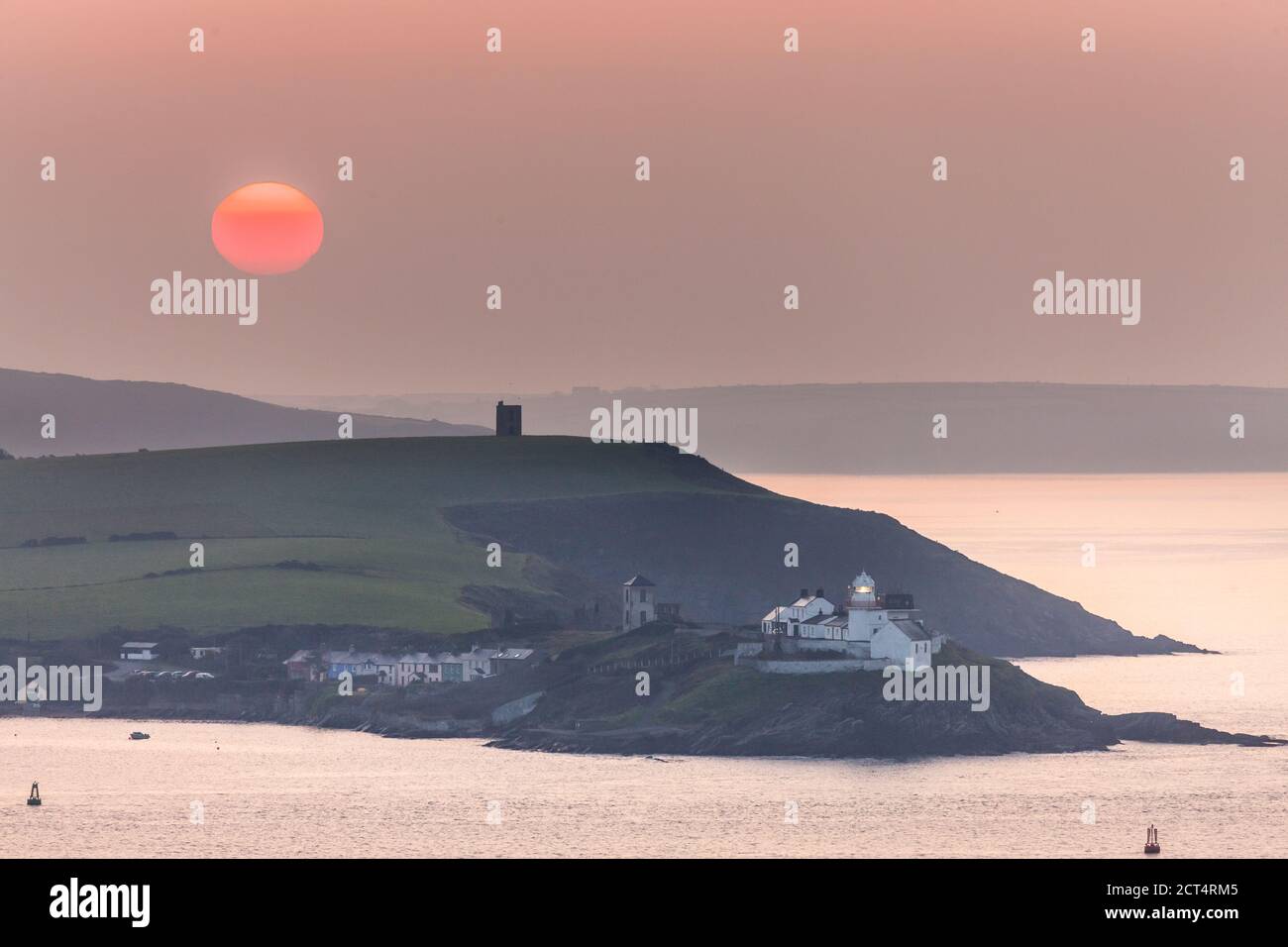 Roches Point, Cork, Ireland. 21st September, 2020. Sun begins to rise at Roches Point, Cork, Ireland. - Credit; David Creedon / Alamy Live News Stock Photo