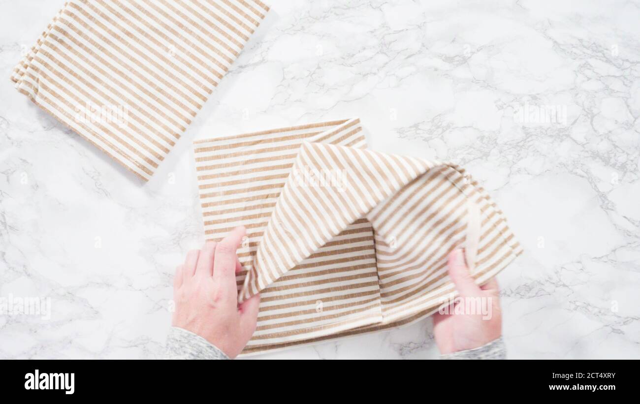 Flat lay. Folding kitchen towels on a marble countertop Stock Photo Alamy