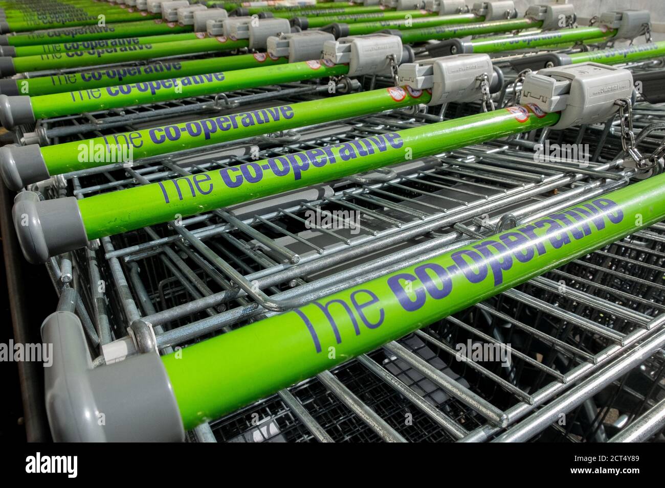 Close up of the handles of a collection of Co-Operative supermarket trollies outside one of the Coop stores in Bournemouth. 11 April 2013. Photo: Neil Stock Photo