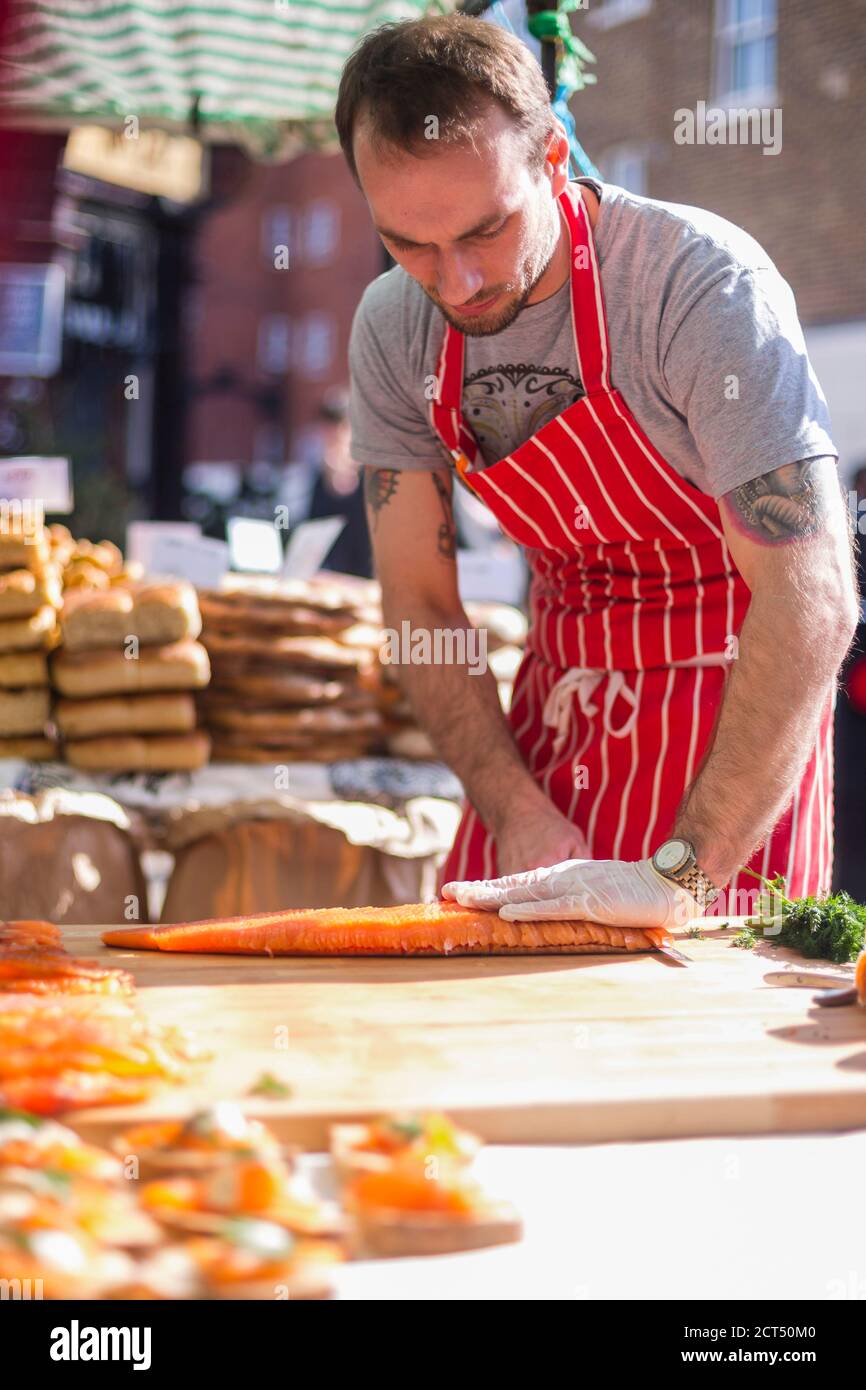 Smoked salmon being served at Broadway Market, Hackney, London, England Stock Photo