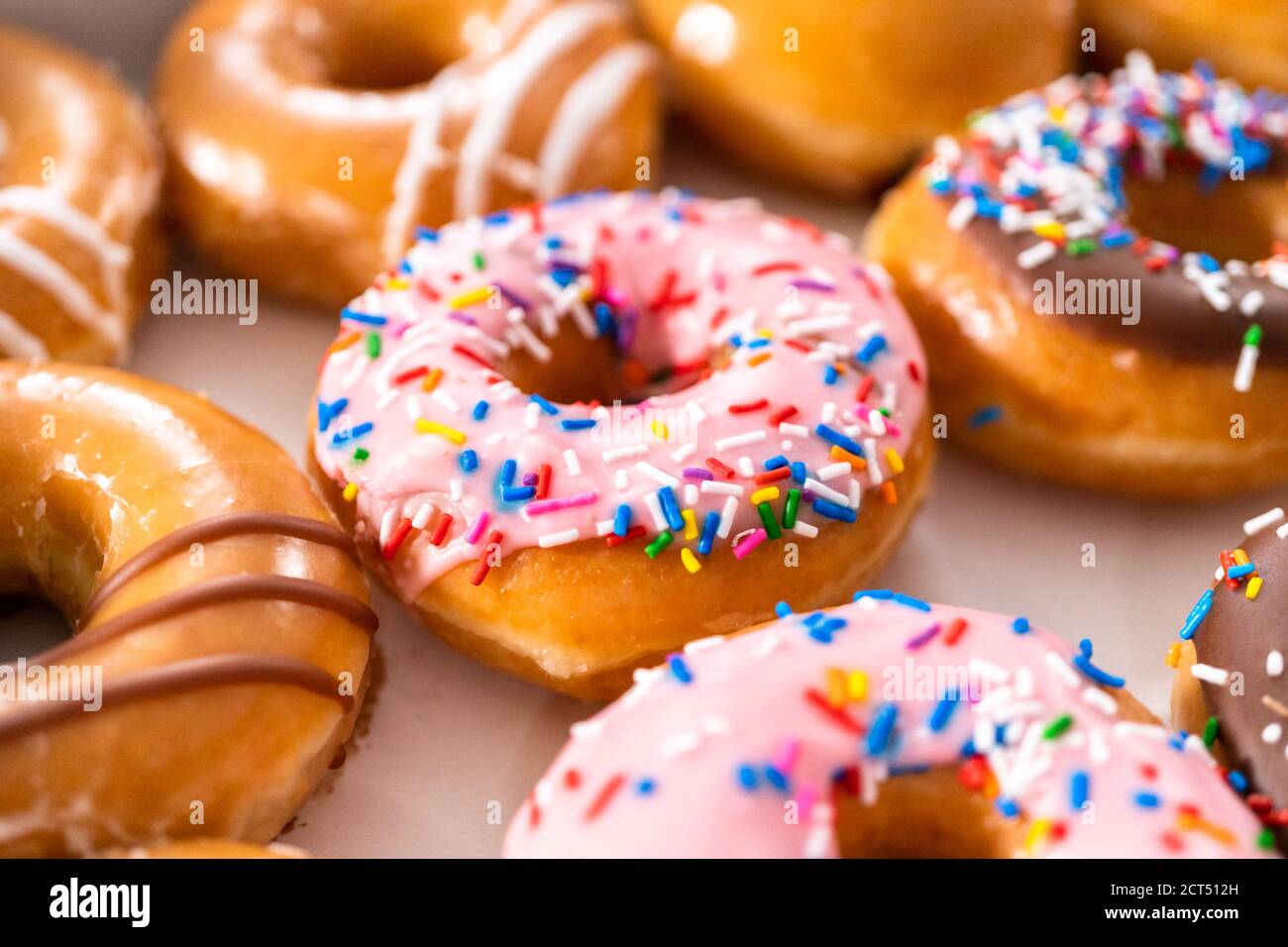 Variety of storebought doughnuts in a white paper box Stock Photo Alamy