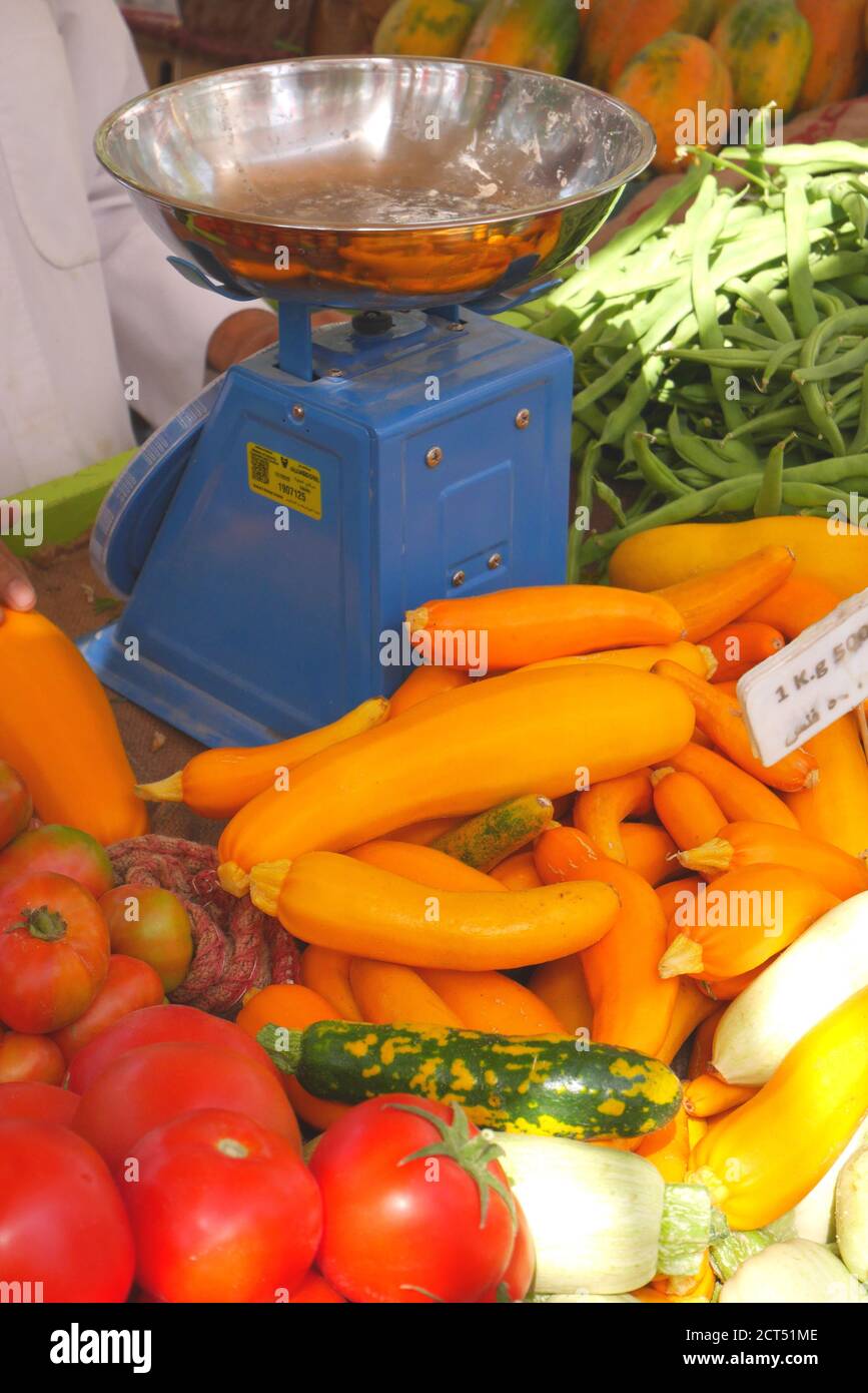 Vegetable stall at the farmers market, with tomatoes, courgettes, beans