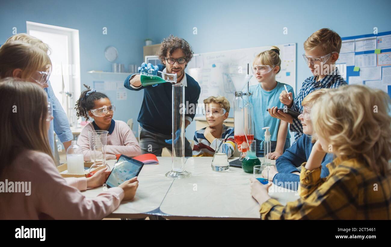 Elementary School Science Chemistry Classroom Teacher Shows Chemical