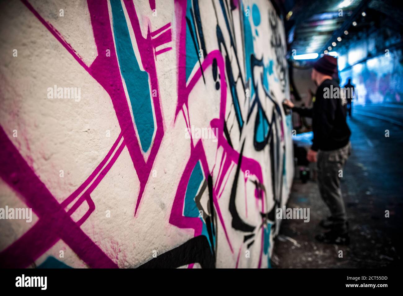 Graffiti artist at Waterloo Leake Street Graffiti Tunnels in central