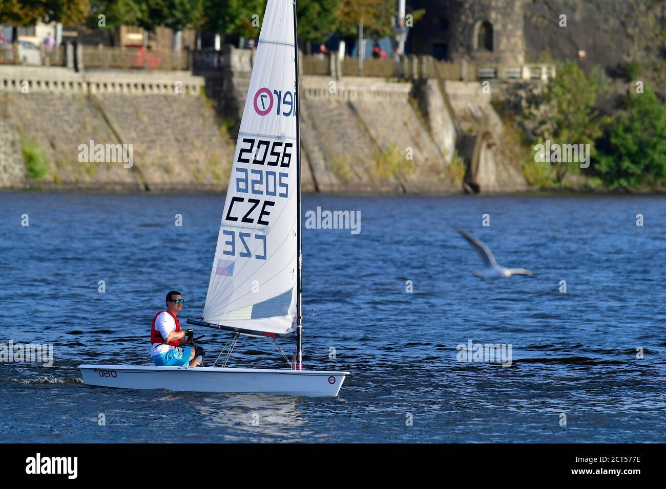 a yachtsman sailing on the river in the city Stock Photo
