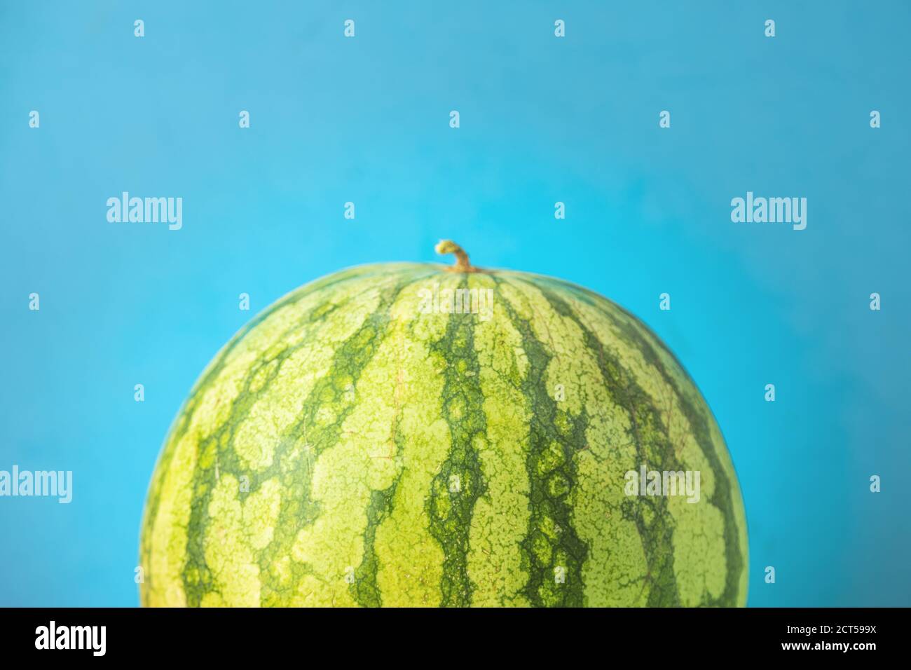 Closeup shot of fresh watermelon on a blue background Stock Photo - Alamy