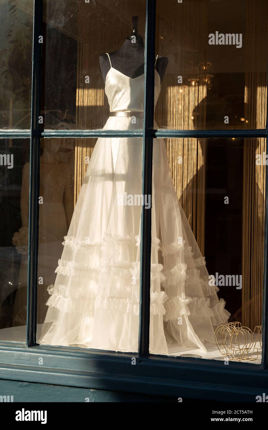 Wedding dress in shop window Amelia and Alci bridal boutique shop