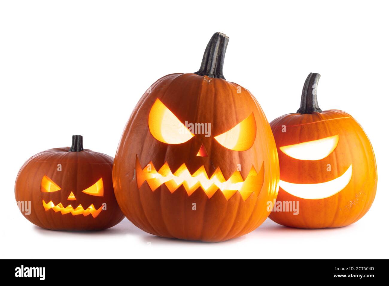 Three glowing cute Halloween Pumpkins isolated on white background ...