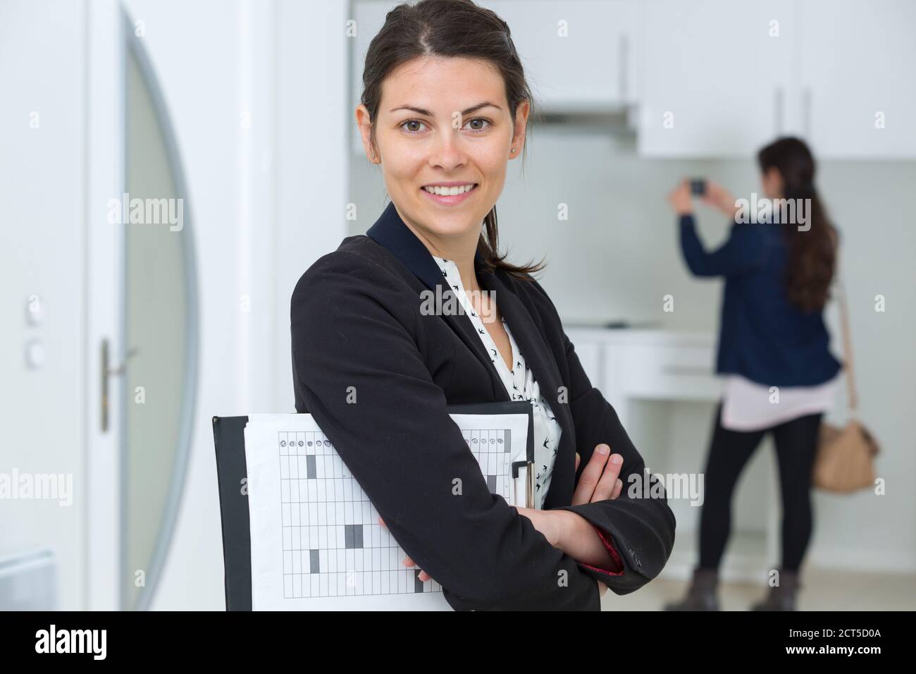 happy real estate agent looking at the camera Stock Photo Alamy