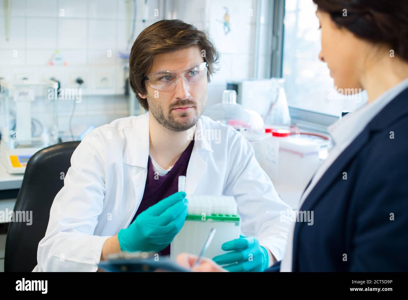 lab worker in uniform testing new substance Stock Photo Alamy