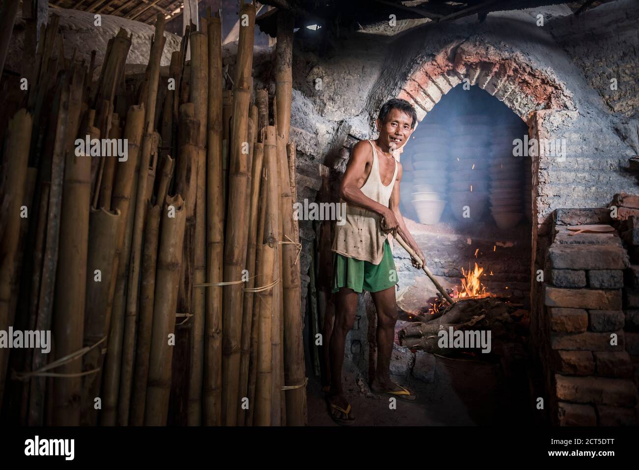 Portrait of a potter in an Oh Bo pottery shed, Twante, near Yangon, Myanmar (Burma) Stock Photo
