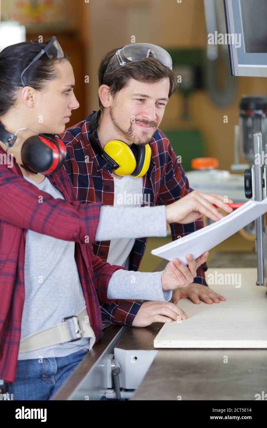 2 carpenters in wood workshop Stock Photo