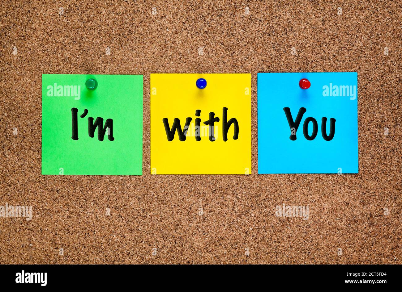 Three colored notes on corkboard with words I’m with You. Stock Photo