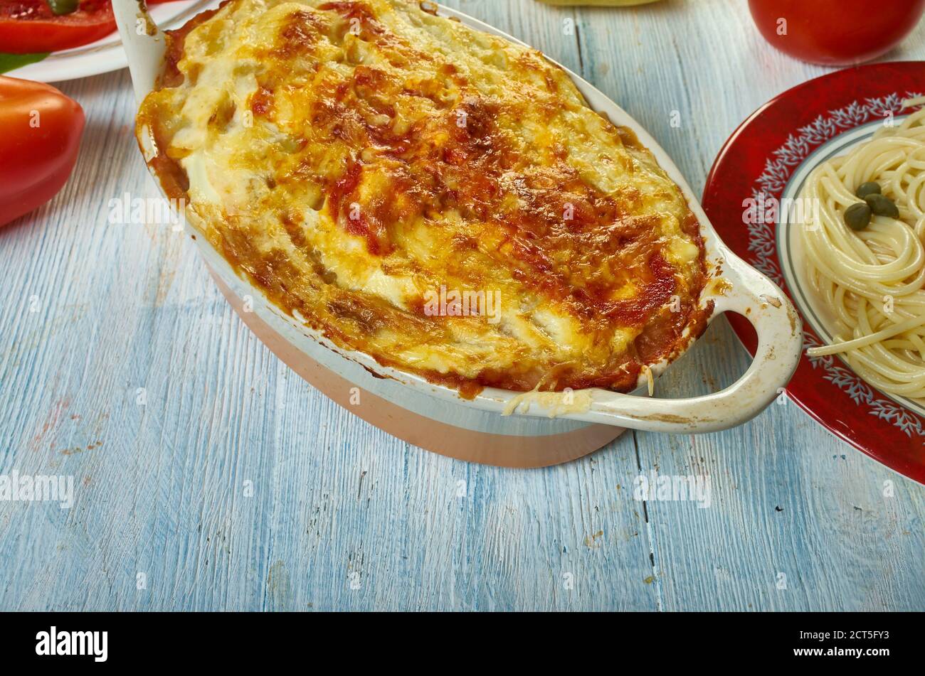 Gatto' di patate con ragu, potato with meat casserole, Sicilian cuisine, Traditional assorted Italy dishes, Top view. Stock Photo