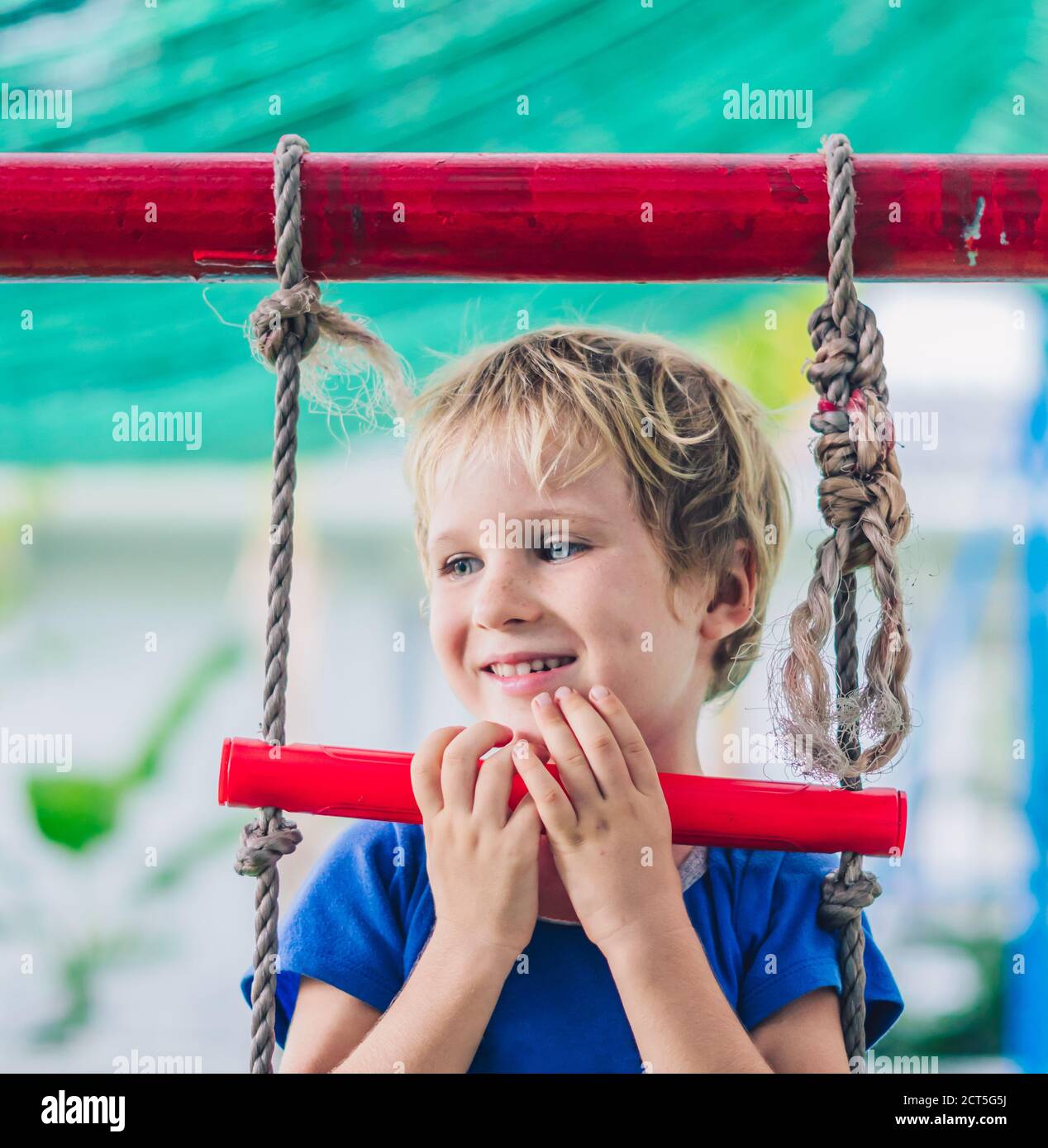 Close portrait Happy smile freckle blue eyed cute blond little boy