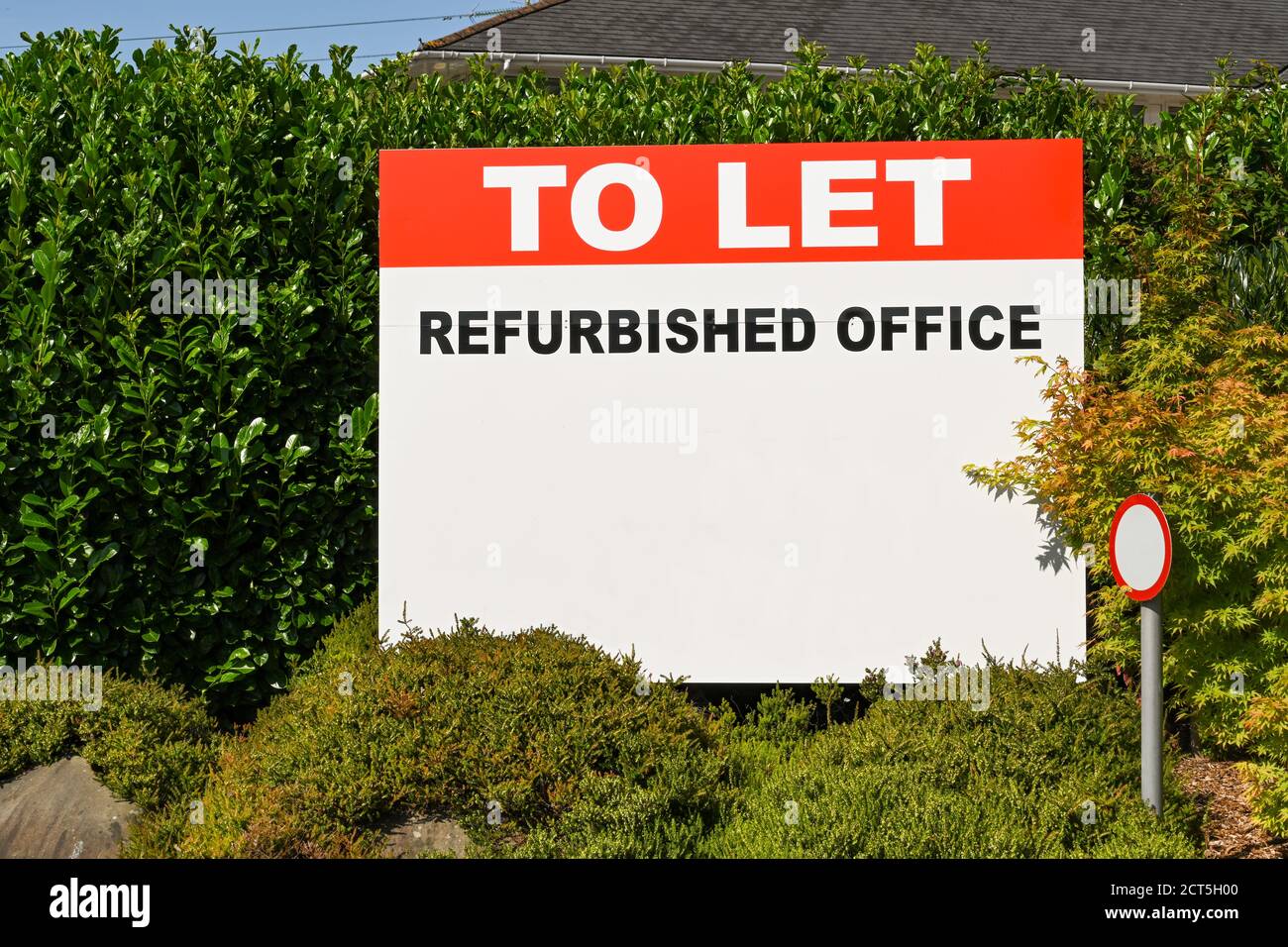 Sign advertising an empty office building available to let. No people, Copy space. Stock Photo