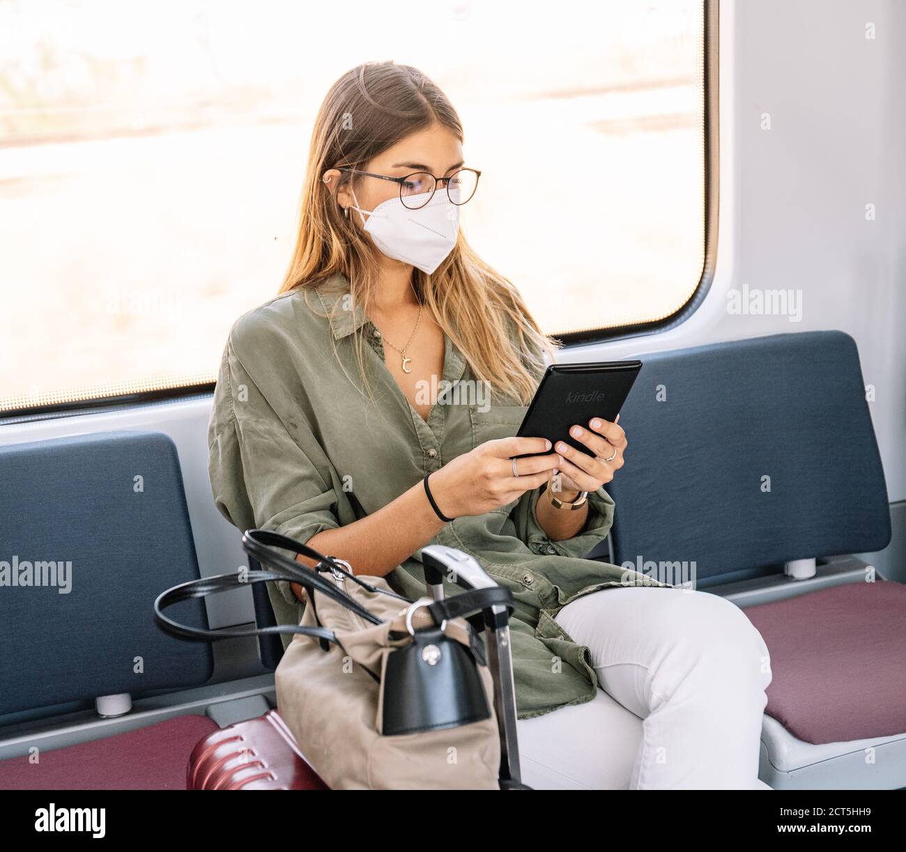 Woman e reader train hi-res stock photography and images - Alamy