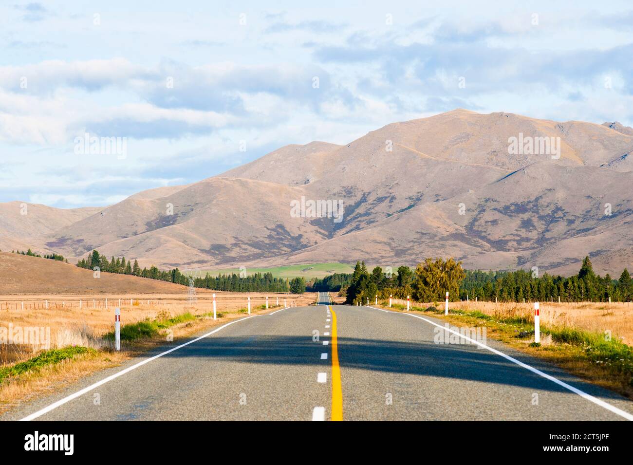 Photo of a Long Straight Road in South Island, New Zealand Stock Photo