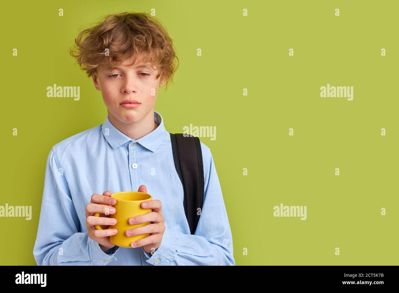 young teen boy want to sleep but he needs to go to school, stand with