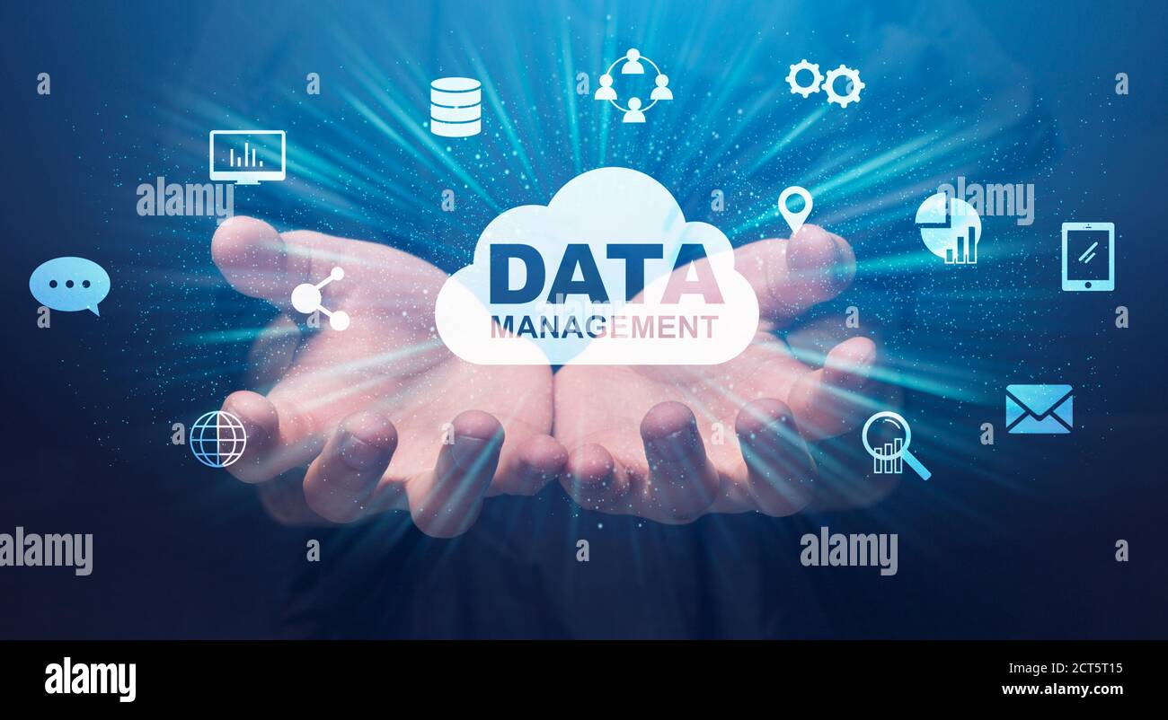 Data Management Conceptual Collage With Human Hands Holding Storage Cloud And Icons Stock Photo