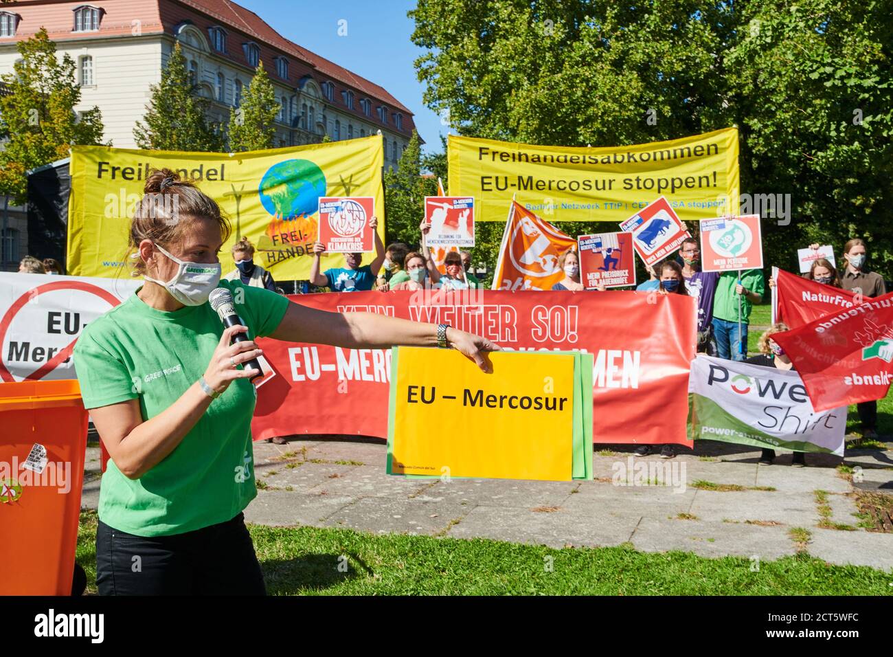 Berlin, Germany. 21st Sep, 2020. Gesche Jürgens, a Greenpeace activist, symbolically throws a poster with the inscription 'EU-Mercosur' into the trash can. Various organisations are protesting in front of the Federal Ministry of Economics under the slogan 'Free trade agreements in the bin!' on the occasion of the informal talks of EU trade ministers against free trade and investment protection agreements between the EU and other states. Credit: Annette Riedl/dpa/Alamy Live News Stock Photo