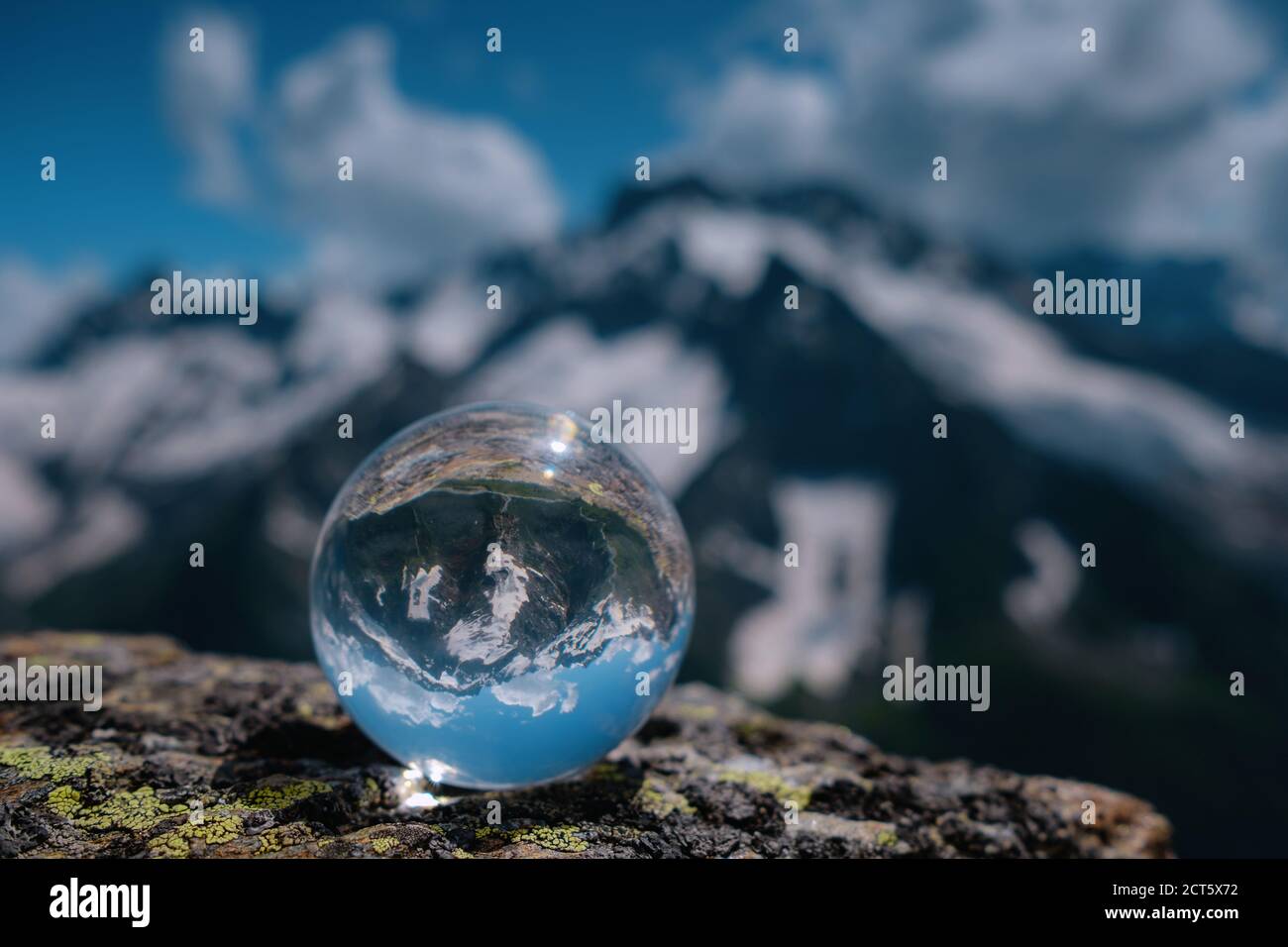 beautiful spherical glass ball with majestic Caucasian mountains 