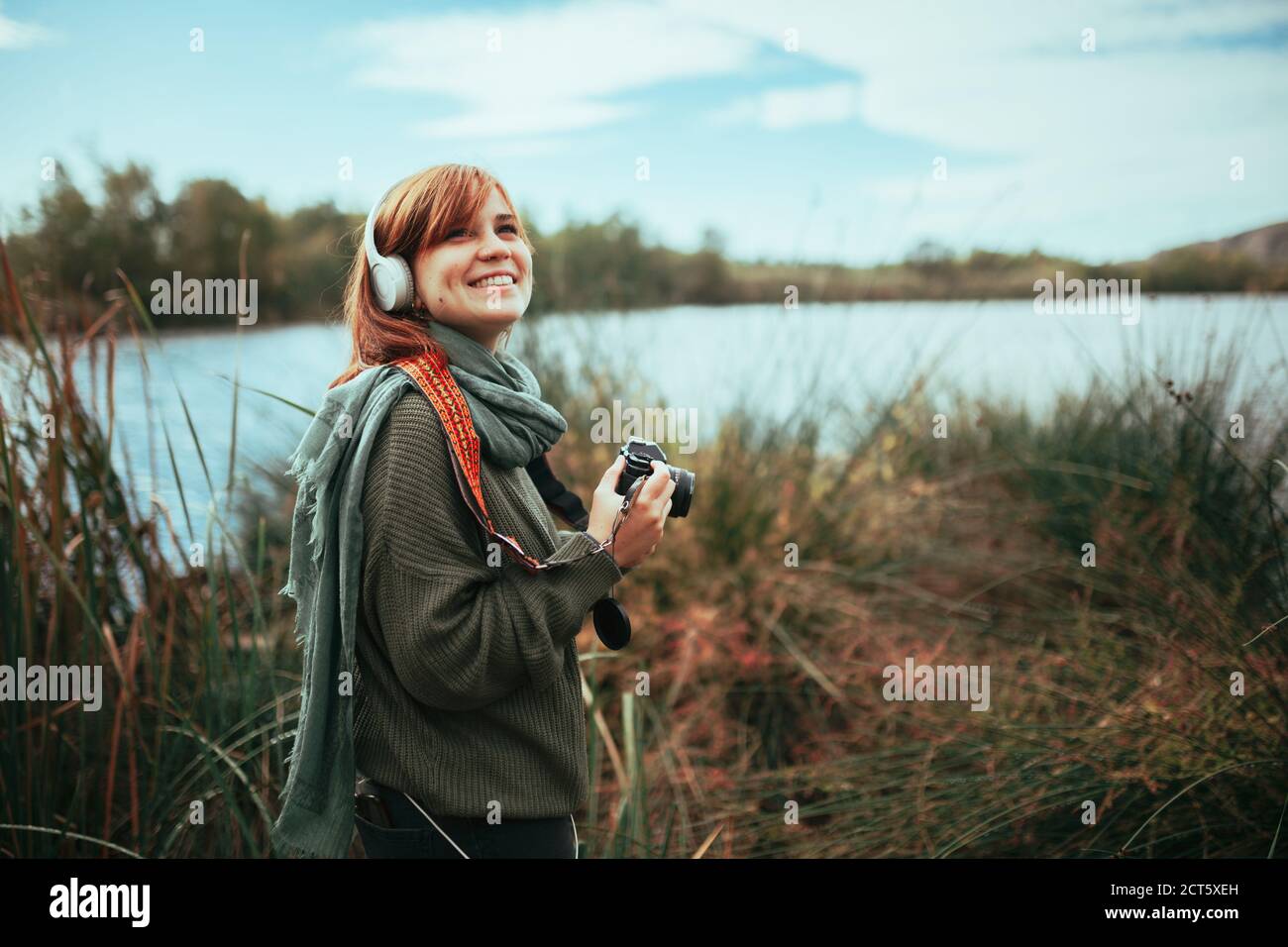 Young woman taking photos in the forest with an old camera Stock Photo ...