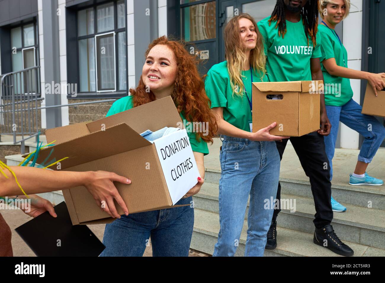 Man giving donation boxes hi-res stock photography and images - Alamy
