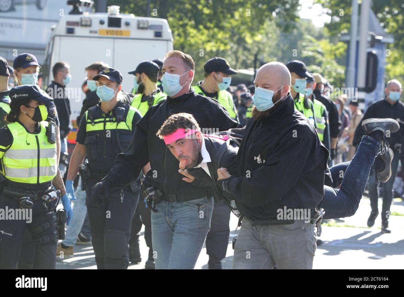 Amsterdam, Netherlands. 21st Sep, 2020. Dutch police officers arrest an Extinction Rebellion activists during protest block the street at the Zuidas financial district amid the Coronavirus pandemic on September 21, 2020 in Amsterdam, Netherlands. Environmental protectors of Extinction Rebellion make a demonstration against the lobby of the large companies their influence on politics, climate and ecological crisis and this consequences and demand a citizen's assembly for a just climate policy. (Photo by Paulo Amorim/Sipa USA) Credit: Sipa USA/Alamy Live News Stock Photo