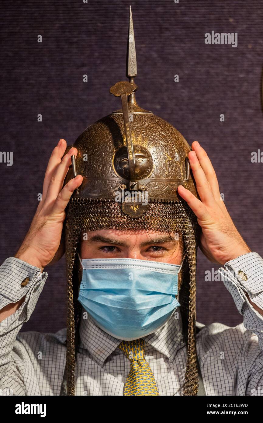 London, UK. 21st Sep, 2020. A Persian Steel Kulah Khud Qajar helmet, 19thC, est £800-1200 Preview of Bonhams' Antique Arms and Armour sale at their Knightsbridge saleroom. The sale will take place on Wednesday 23 September Credit: Guy Bell/Alamy Live News Stock Photo