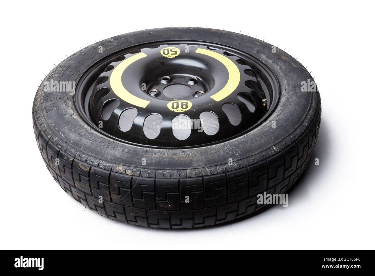 New car spare wheel tire isolated on white background. Auto service
