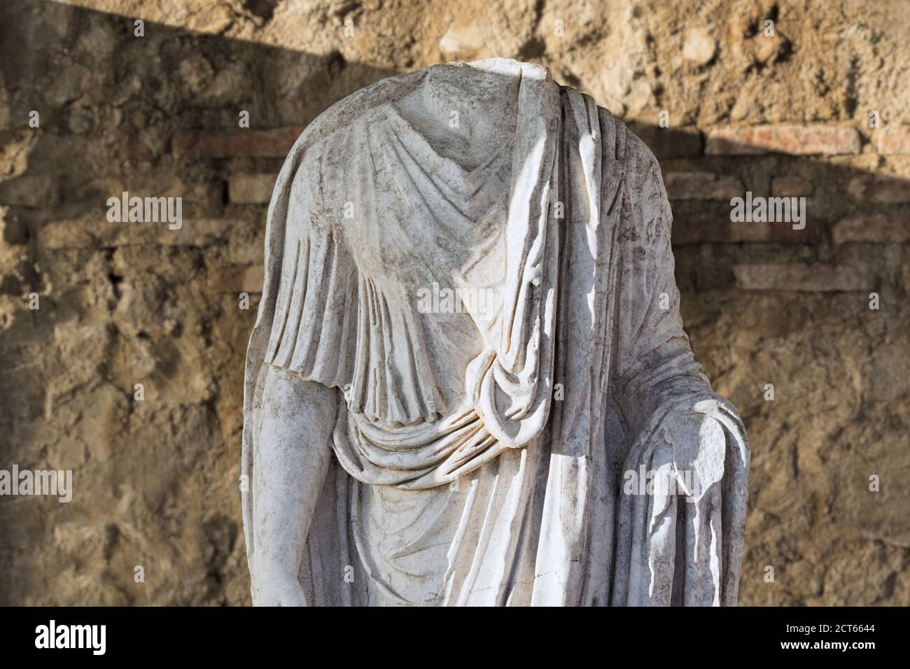 Headless roman statue at archaeological site of the ancient town of