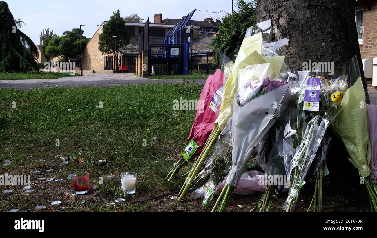 Floral tributes left at the scene of the murder of teenager Mohamed Dura-Ray. His mother, Marama Baby Kamara revisited the scene of her son's killing in Canterbury Place, Kennington, following the five-year anniversary of his death. Stock Photo