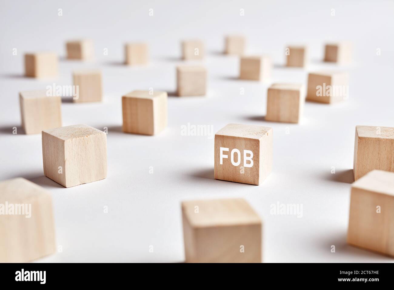 The word FOB (free on board) on wooden cubes. Logistic distribution, warehouse or delivery industry or business concept. Stock Photo