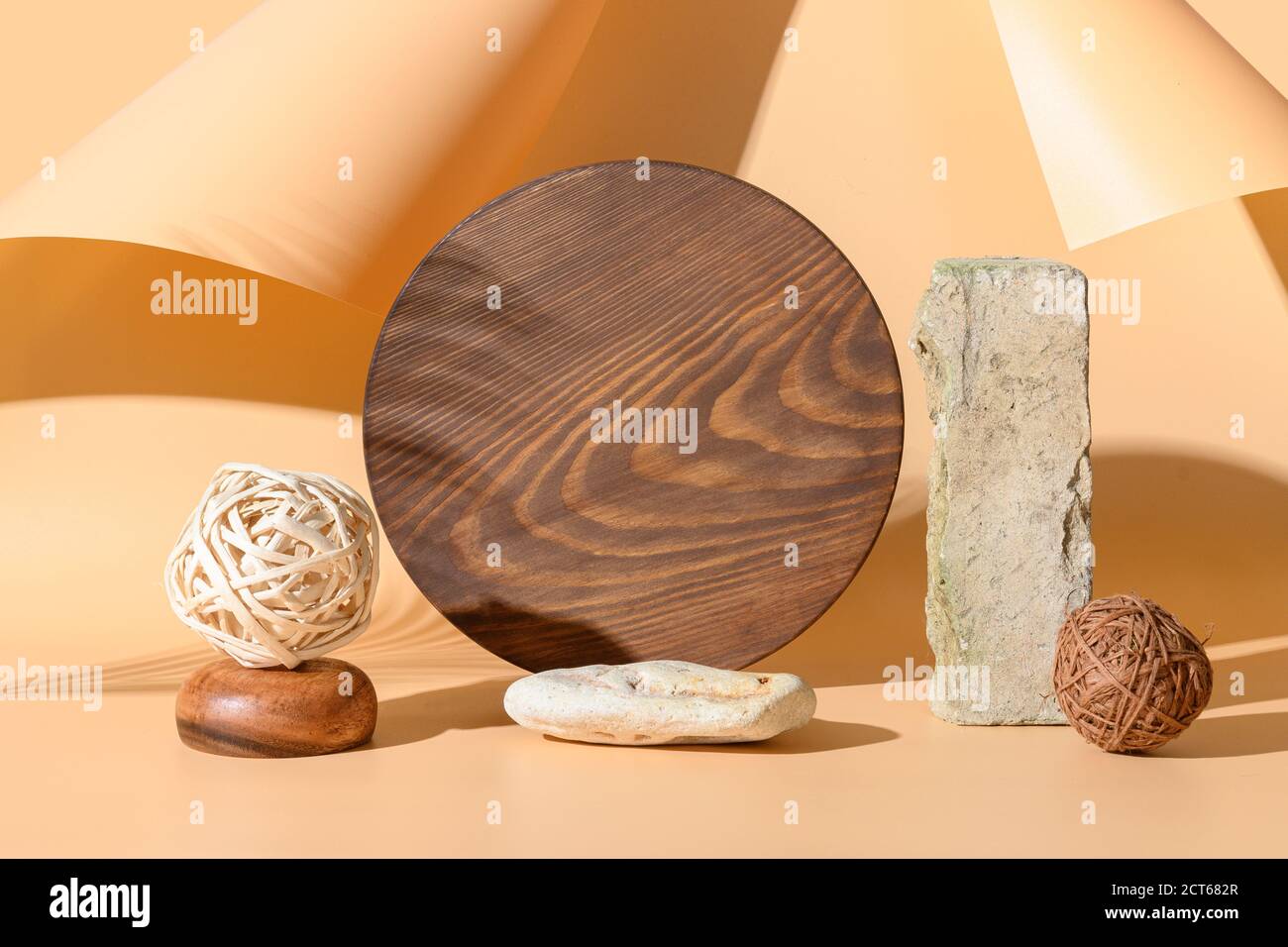 Podiums for products of natural materials stone, bricks, wooden board with sunny shadow on beige background. Monochrome creative template or mock up. Stock Photo