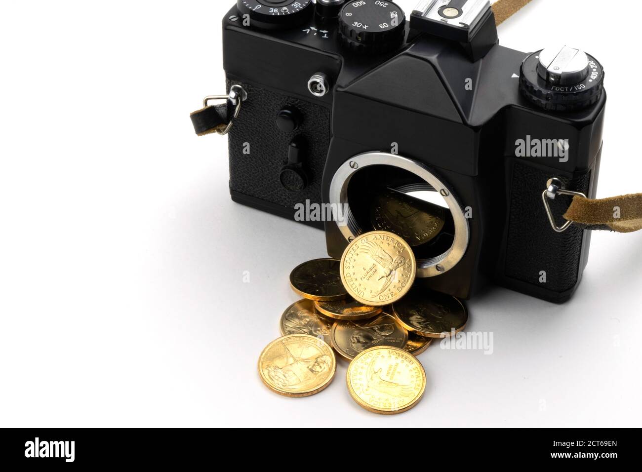 camera with dollars pouring from it on a white background Stock Photo