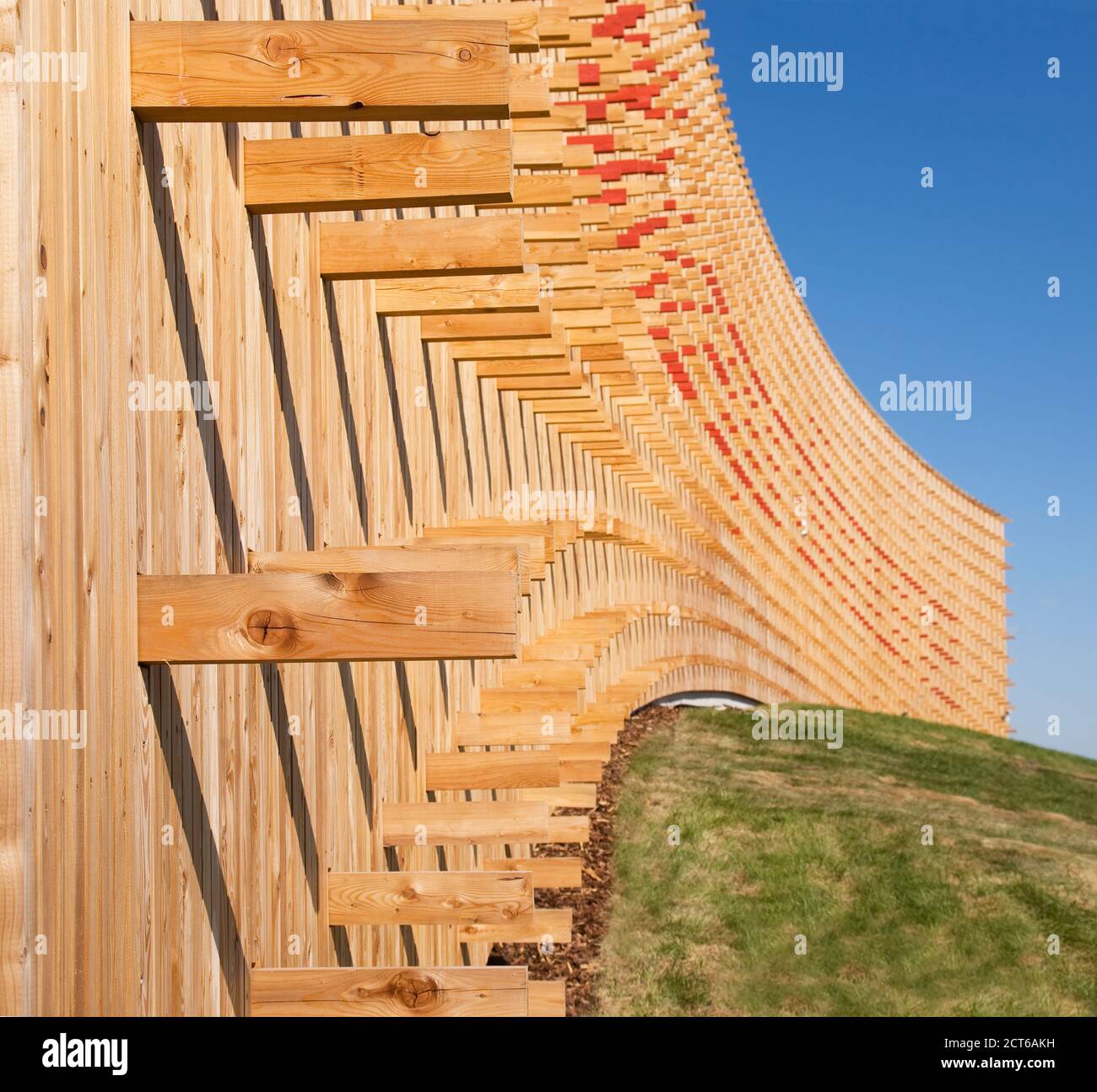 Modern university buildings, wooden beams projecting from a curved wood