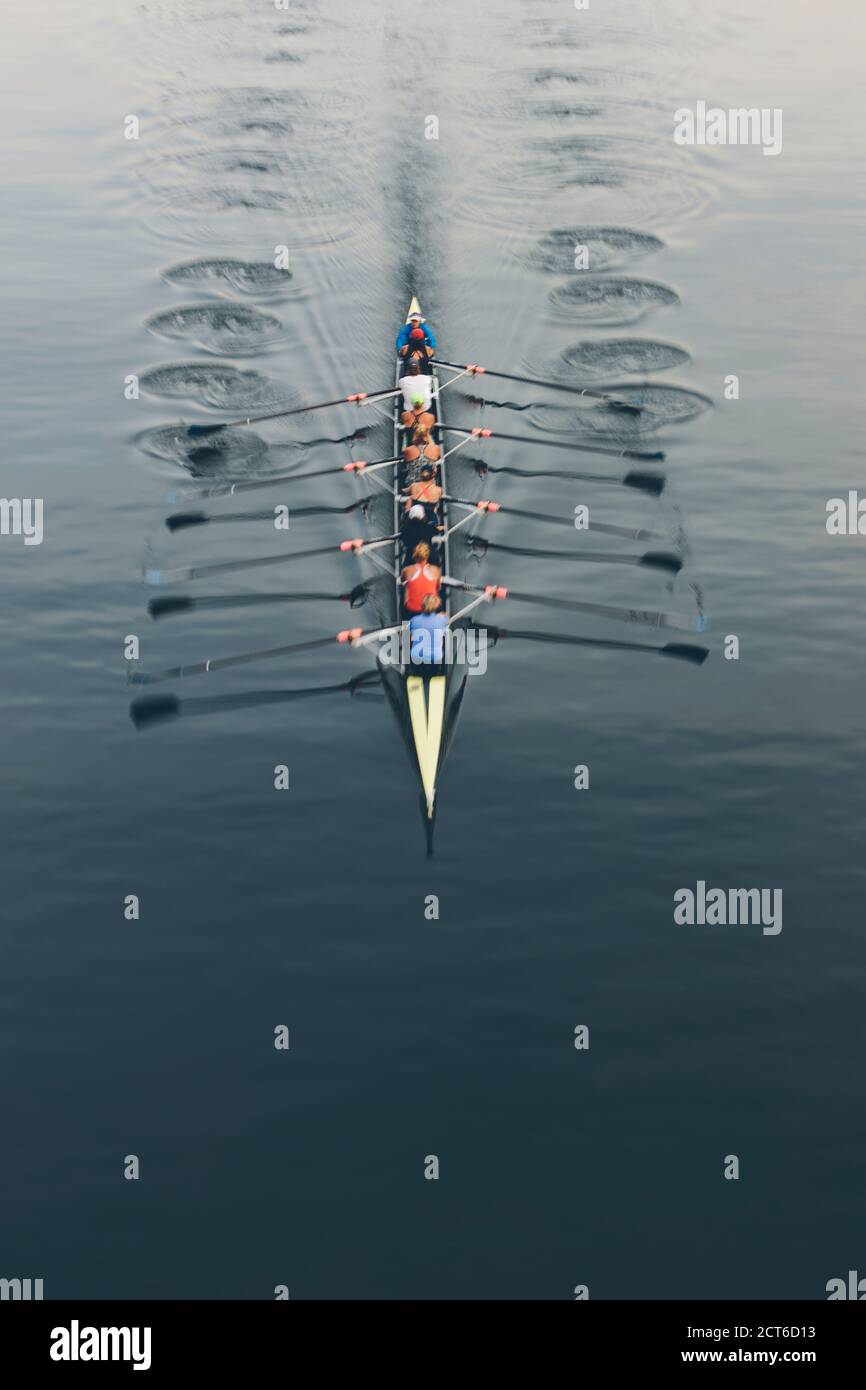 Overhead view of a crew in an eights boat rowing on a lake Stock Photo